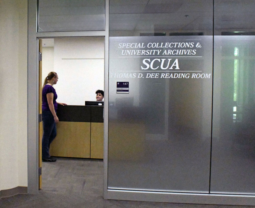 Entrance to SCUA area, you can see two people talking to each other through an open door